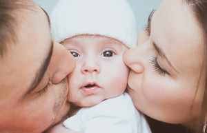 Young mother and father with newborn